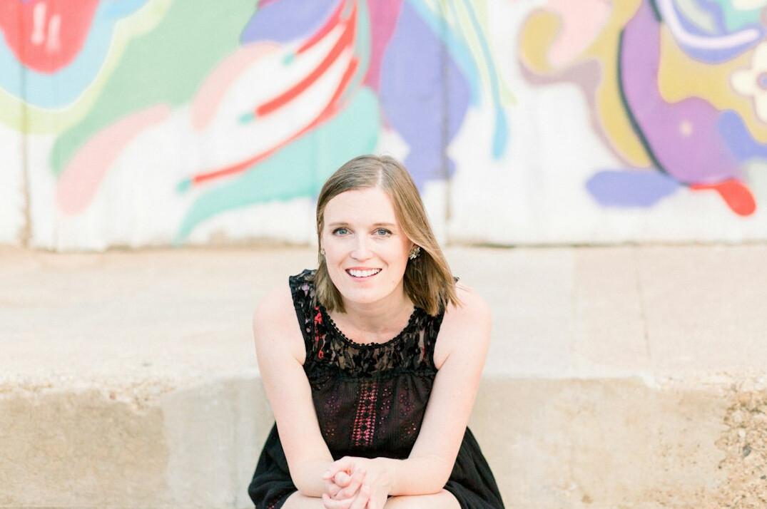 Portrait of a professional woman with dark hair smiling