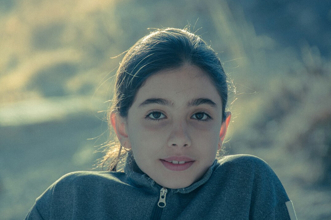 Portrait of a smiling young woman with brown hair